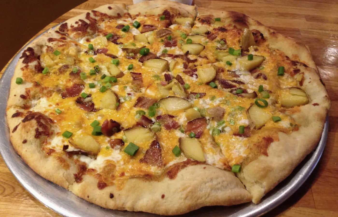 A potato-and-bacon pizza made with local ingredients